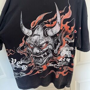 Edgy Black Graphic Tee with Red and White Design